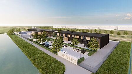 Op een langgerekt terrein zie je vooraan een parkeerplaats, aan de achterkant langs de lange zijde zie je de gebouwen van het afvalstation, de gemeentewerf en KansisGroen. Om het terrein heen zie je weilanden, een sloot en weg.